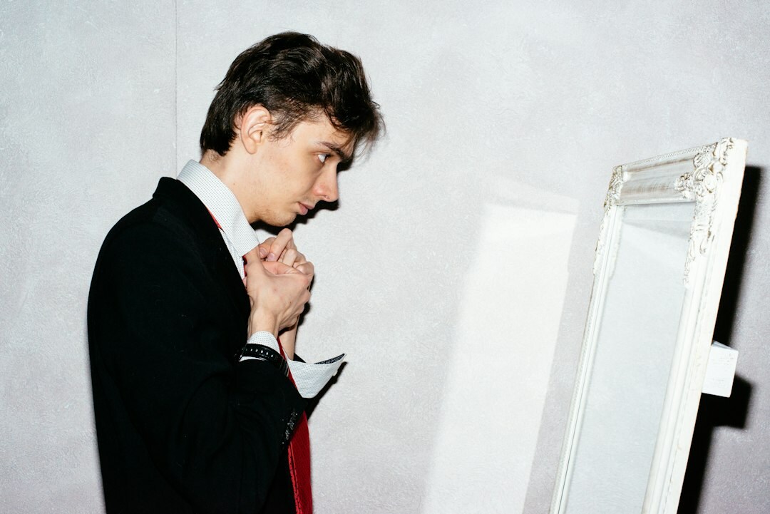 man practicing speech mirror