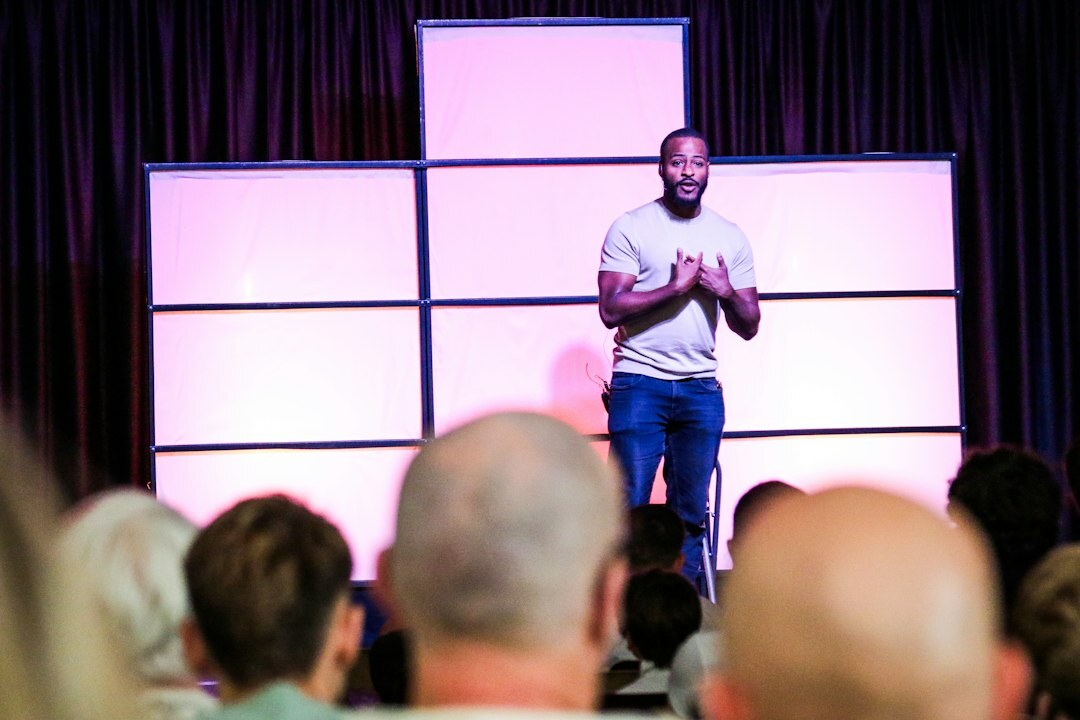 person giving speech on stage