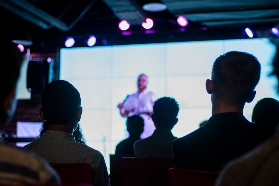 confident speaker on stage